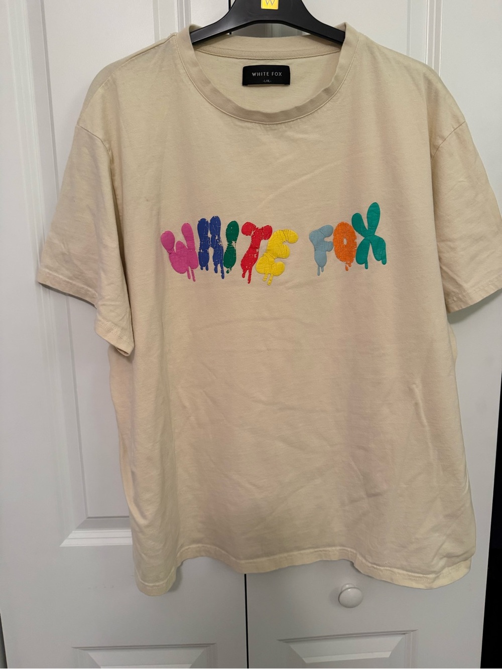 White Fox Boutique Womens oversized Cream Graphic Tee with Rainbow Drip Logo